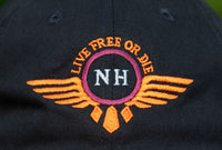 close up image of the live free or die wings logo
