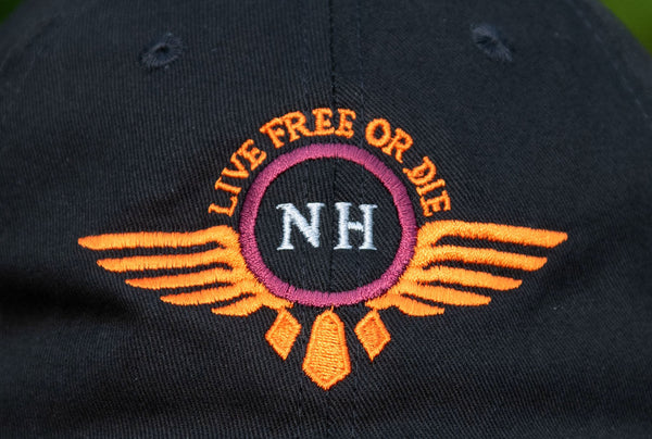 close up image of the live free or die wings logo