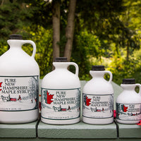 four different sizes of maple syrup bottles
