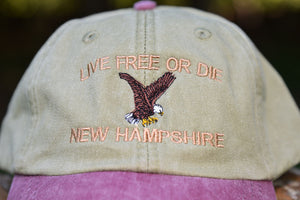 Six-panel hat with the words “Live Free or Die” and an eagle embroidered.